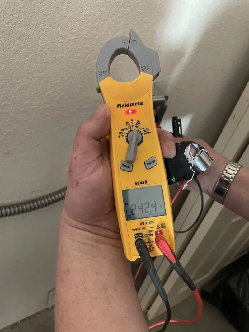 Voltage testing with clamp meter during Recessed Lighting Installation in Haverford